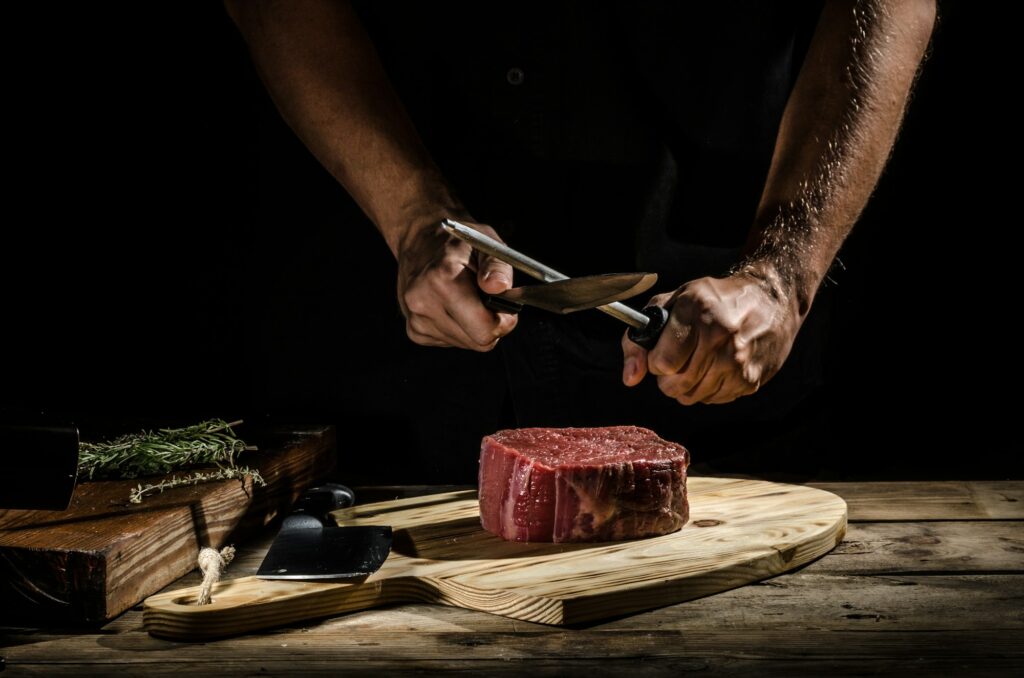 Chef butcher prepare beef steak